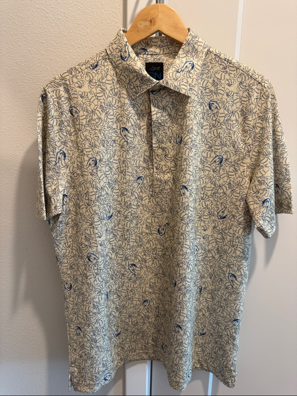 Greg Norman Men's Short Sleeve Polo Shirt in Cream with Monstera Tropical Print